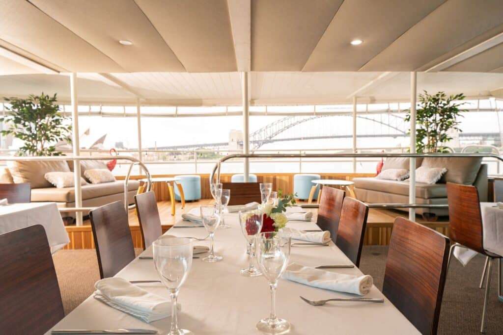 a table set for a dinner party on a function boat in sydney