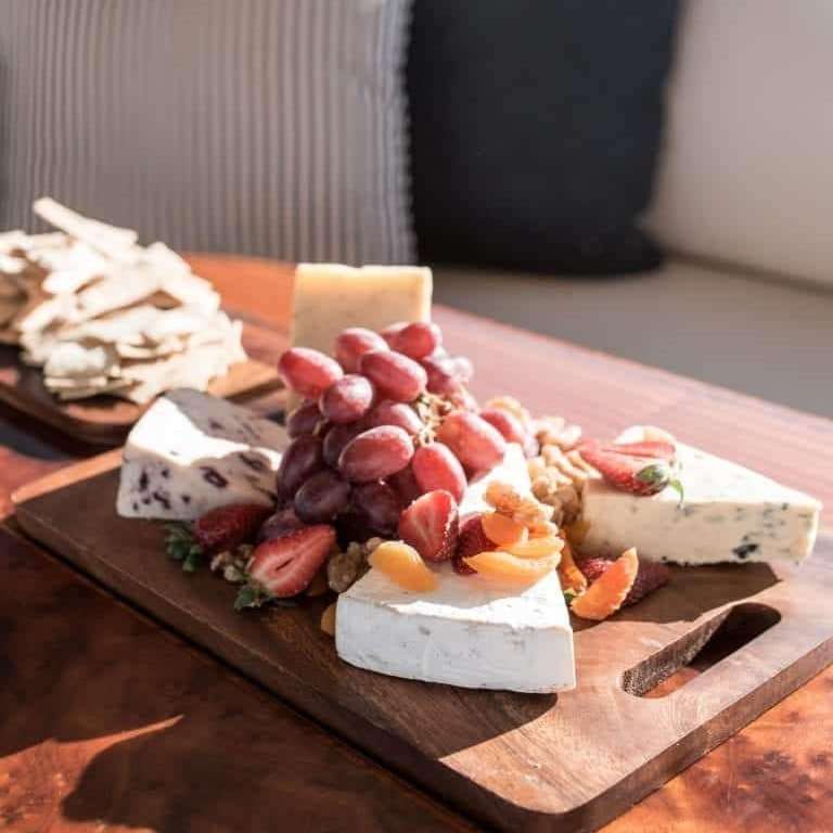 a plate of cheese and fruit