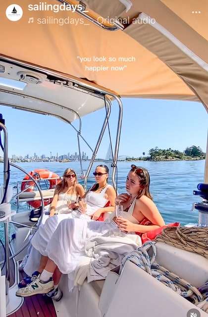 Champagne on board with Sydney Harbour skyline at sunset