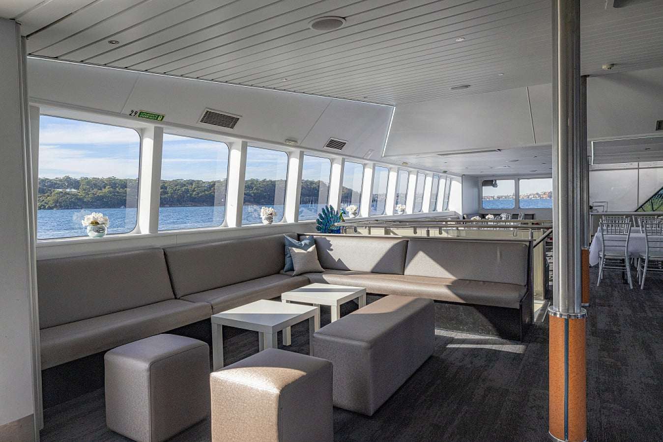 Dinner table setup inside a Sydney Harbour function vessel